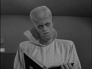 The Kanamit holding his book in The Twilight Zone episode 'To Serve Man'